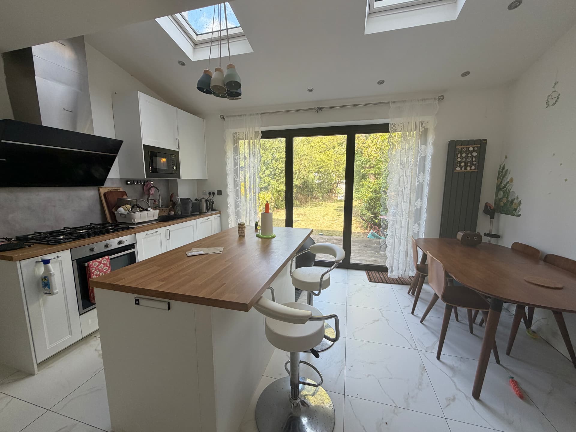 Kitchen with island and skylights
